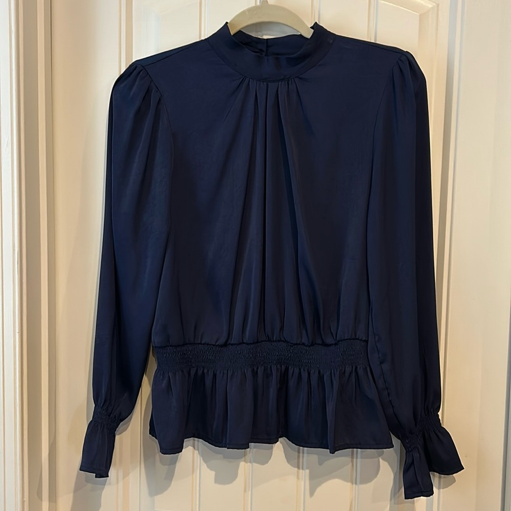 Navy blue peplum style dress top.